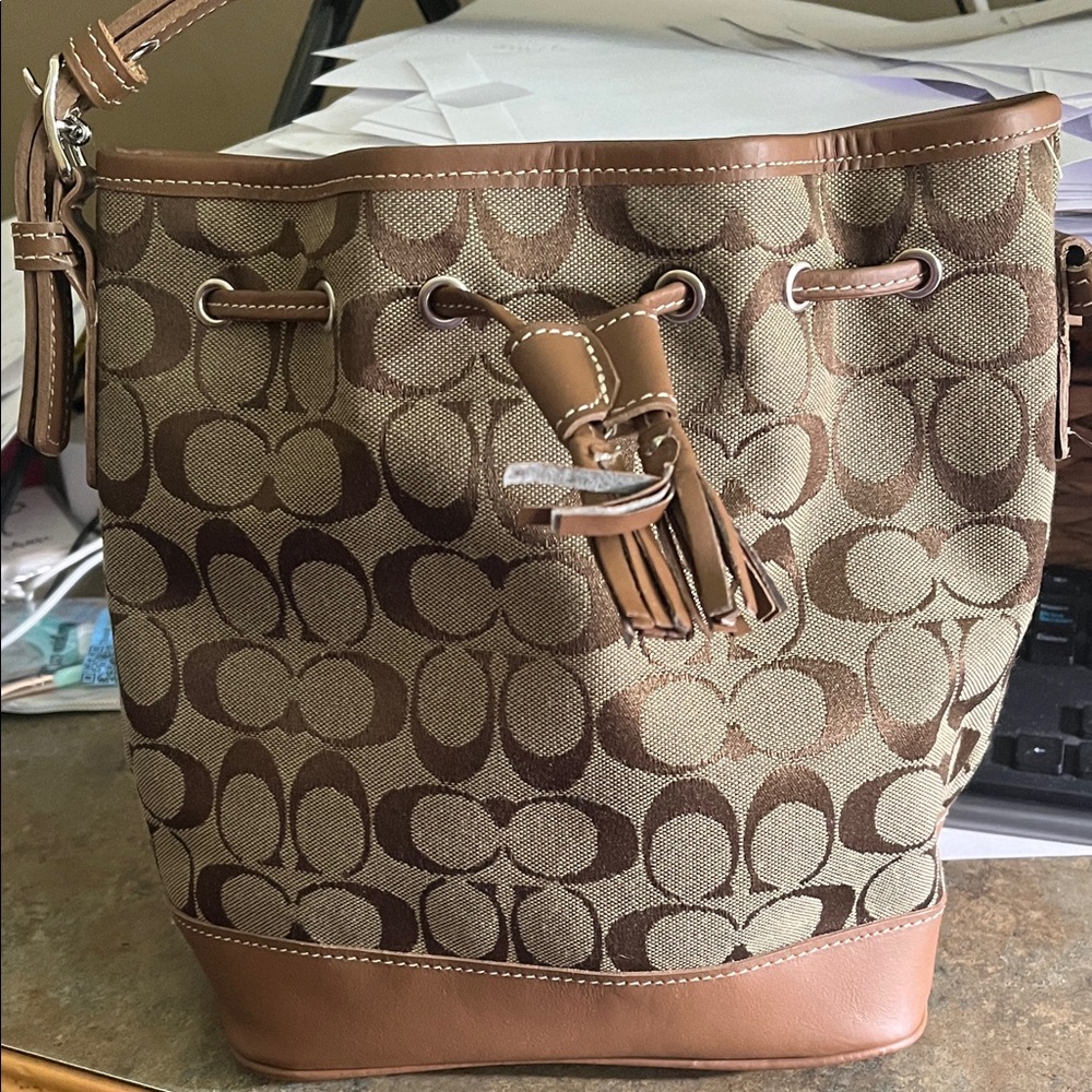 Coach Tan and Brown Signature Canvas Drawstring Bucket Bag.